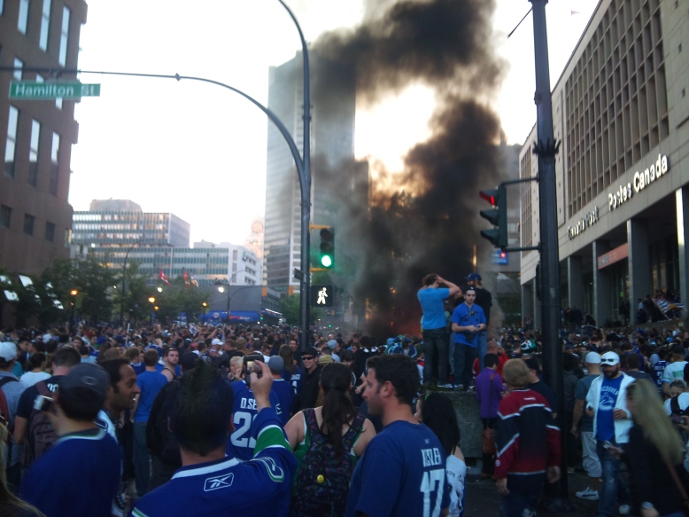Vancouver Canuck hockey fans riot on the street after a playoff game